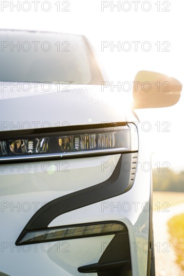 Modern white car body viewed from the front in sunlight, Deer e-Carsharing, Renault Megane, Calw, Germany