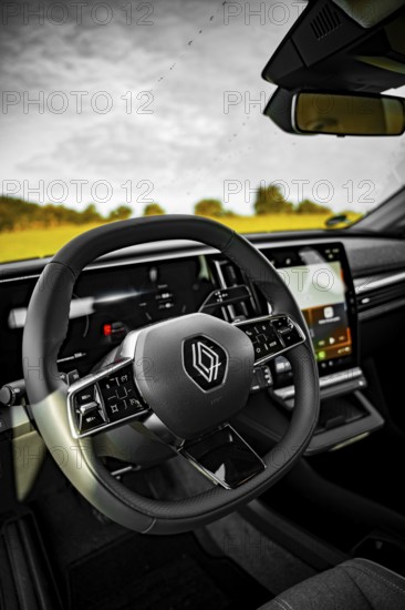 Modern car interior with detailed steering wheel and large display, Deer e-Carsharing, Renault Megane, Calw, Germany