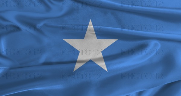 Flag of Somalia with fabric textured background. Close up of National flag of Somalia with realistic texture