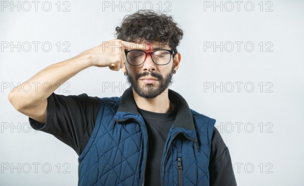 Man with nasal bridge pain on white background. Person with nasal bridge ache isolated