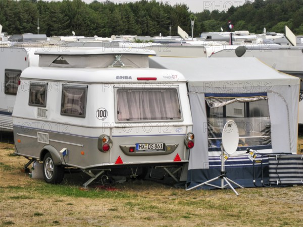 Fully staffed campsite in high season, nostalgic caravan with raised roof, awning, Hymer Eriba Touring, Wenningstedt, Sylt, Germany