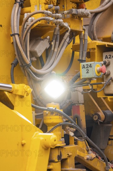Detailed view of hydraulic lines and technical components of a machine, tamping machine on Hermann, Hesse, Bahn, Althengstett, Calw district, Germany