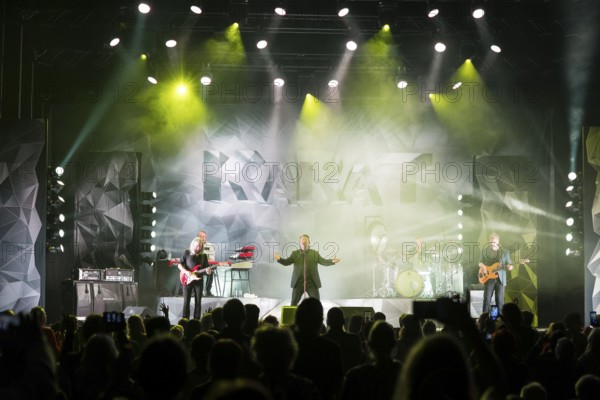 Bernd Römer (guitarist), Martin Becker (keyboarder), Claudius Dreilich (singer), Heiko Jung (drummer) and Daniel Bätge (bassist) from Karat live on 50 Years of KARAT Tour in Berlin's Max-Schmeling-Halle on 19 December 2025
