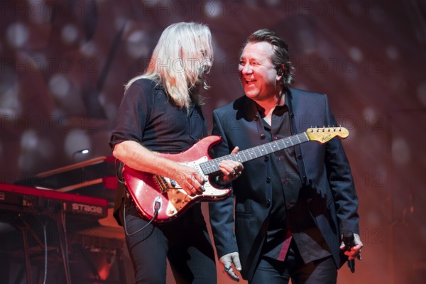Bernd Römer (guitarist) and Claudius Dreilich (singer) from Karat live on 50 Years of KARAT Tour at the Max-Schmeling-Halle in Berlin on 19 December 2025