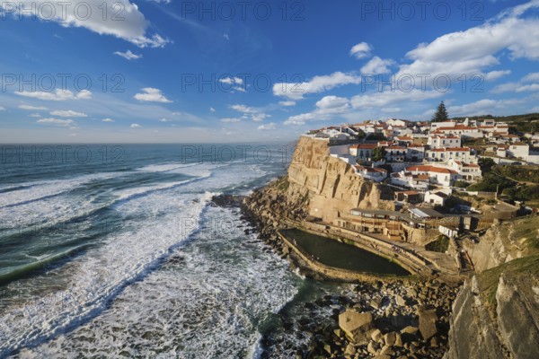 Charming seaside village of Azenhas do Mar perched on cliffs above the Atlantic Ocean. Enjoy stunning views, unique architecture, and the beauty of nature along the coast