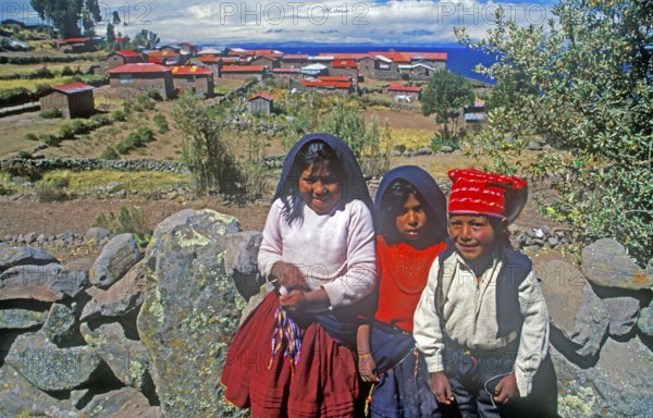Children wearing traditional clothes on Isla Taquile in Lake Titicaca, Andean Highlands, Peru, South America, September 1997, vintage, retro, old, historic