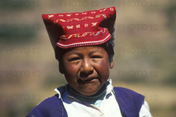 Little boy wearing traditional clothes on Isla Taquile in Lake Titicaca, Andean Highlands, Peru, South America, September 1997, vintage, retro, old, historic