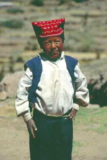 Little boy wearing traditional clothes on Isla Taquile in Lake Titicaca, Andean Highlands, Peru, South America, September 1997, vintage, retro, old, historic