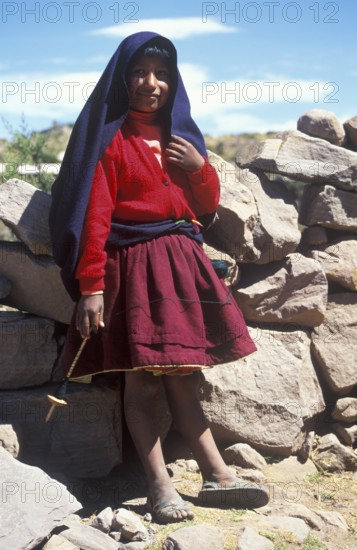 Little girl wearing traditional clothes on Isla Taquile in Lake Titicaca, Andean Highlands, Peru, South America, September 1997, vintage, retro, old, historic