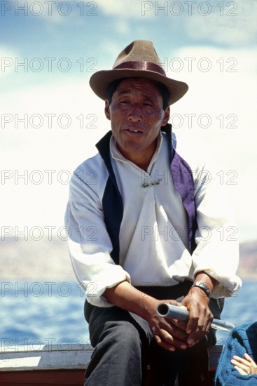 Boat driver, Lake Titicaca, Puno, Andean highlands, Peru, South America, September 1997, vintage, retro, old, historic