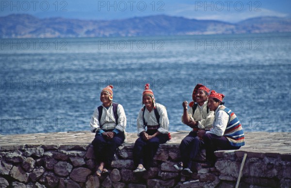Men wearing traditional clothing on Isla Taquile in Lake Titicaca, Andean Highlands, Peru, South America, September 1997, vintage, retro, old, historic