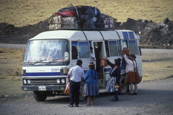 Women selling food on the side of the road to bus travelers, Andean highlands near Puno, Peru, South America, September 1997, vintage, retro, old, historic