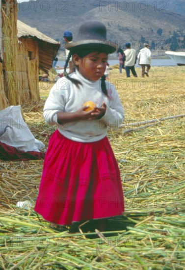 Little girl on a floating Uro island in Lake Titcaca, Andean highlands, Peru, South America, September 1997, vintage, retro, old, historic
