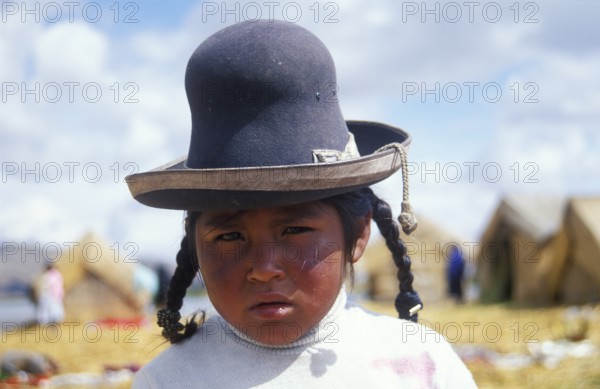 Little girl in traditional clothing on a floating Uro island in Lake Titcaca, Andean highlands, Peru, South America, September 1997, vintage, retro, old, historic