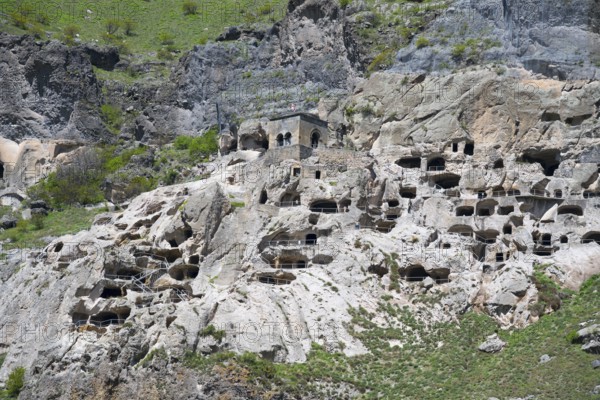Close-up of caves artfully integrated into a rocky rock wall, cave town, cave monastery, Vardzia, Samtskhe—Javakheti region, Samtske Javacheti, Lesser Caucasus, Georgia