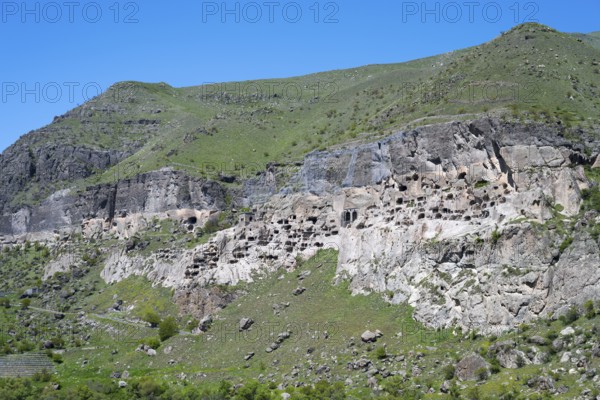 A rocky cliff wall with numerous caves on a hill, cave town, cave monastery, Vardzia, Samtskhe—Javakheti region, Samtske Javacheti, Lesser Caucasus, Georgia