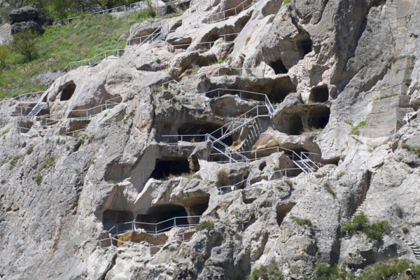 Nested monastery in rocks with caves and balustrades. Historical stone architecture, cave town, cave monastery, Vardzia, Vardzia, Samtskhe—Javakheti region, Samtske Javacheti, Lesser Caucasus, Georgia