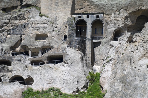 Old rock monastery carved into a rock wall. Impressive architectural structure with caves and stairs, cave town, cave monastery, Vardzia, Samtskhe—Javakheti region, Samtske Javacheti, Lesser Caucasus, Georgia