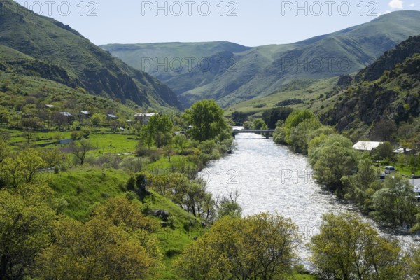 Idyllic valley with a flowing river. Hilly landscape with lush greenery, Kura river, landscape near Vardzia, Samtskhe—Javakheti region, Samtske Javacheti, Lesser Caucasus, Georgia
