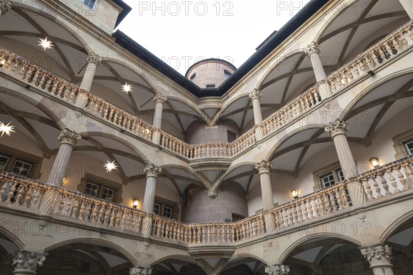 At Christmas time, the Old Palace in Stuttgart shines with festive poinsettias in the courtyard. The atmospheric lighting creates a romantic atmosphere and invites you to relax