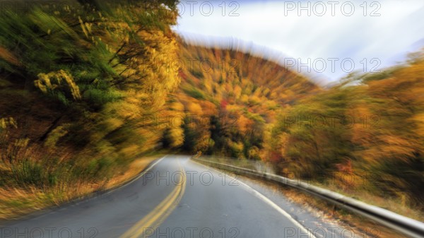 Curvy country road, downhill, autumn leaves, Indian summer, traveling, symbolic photo, zoom effect, blur, panoramic Mohawk Trail road, former trade route, Massachusetts, New England, USA