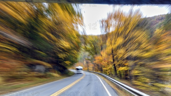 Motorhome, curvy country road, autumn leaves, Indian summer, traveling, symbolic photo, zoom effect, blur, panoramic Mohawk Trail road, former trade route, Massachusetts, New England, USA