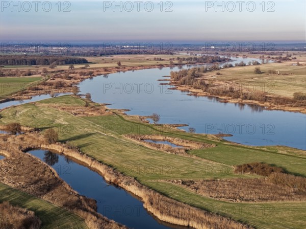 The Elbe in the Elbe floodplain near Bleckede in the Elbe River Landscape Biosphere Reserve on a winter day in the evening light. aerial view. Bleckede, Lower Saxony, Germany