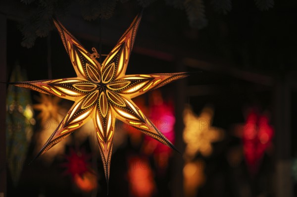 Colorful Christmas stars, sales stand, baroque Christmas market, blue hour, dusk, Ludwigsburg, Baden-Württemberg, Germany