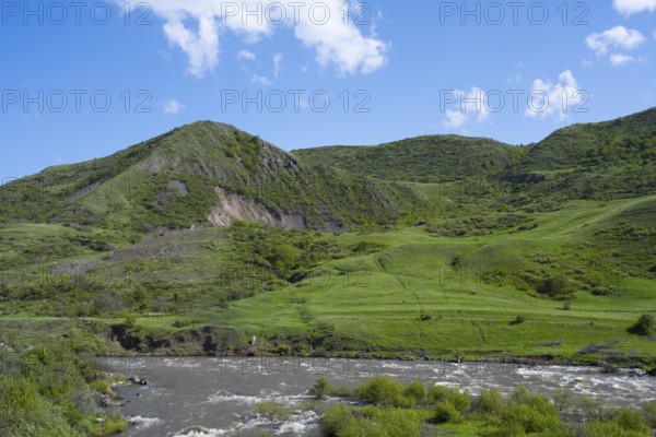 Green hills and a river under a blue sky offer a peaceful landscape, Kura River between Akhaltsikhe, and Aspindza, Samtskhe-Javakheti region, Samtskhe-Javakheti, Georgia