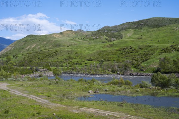 Green hills and a calm river under clear sky, Kura River between Akhaltsikhe, Akhaltsikhe and Aspindza, Samtskhe-Javakheti region, Samtskhe-Javakheti, Georgia