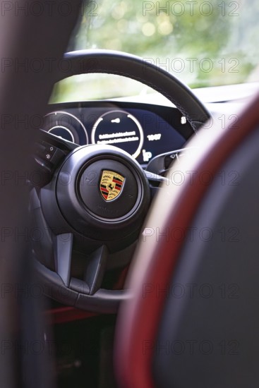 Interior of a vehicle with steering wheel and rear instruments, Porsche Taycan, Deer Carsharing, Calw, Germany