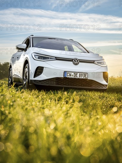 Silver car on green field at morning light, VW ID4 electric car, Deer Carsharing, Calw, Germany