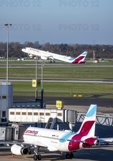 Eurowings aircraft, at terminal A and at takeoff, Düsseldorf airport, DUS
