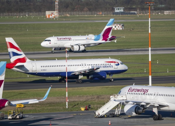 Eurowings aircraft, on field positions and on landing, British Airways Airbus A320-200 on their way to takeoff, Düsseldorf airport, DUS