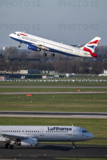 Lufthansa Airbus A321-200 on taxiway for takeoff, British Airways Airbus A320-200 on takeoff, Düsseldorf airport, DUS