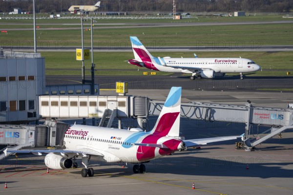 Eurowings aircraft, at terminal A and on their way to takeoff, Düsseldorf airport, DUS