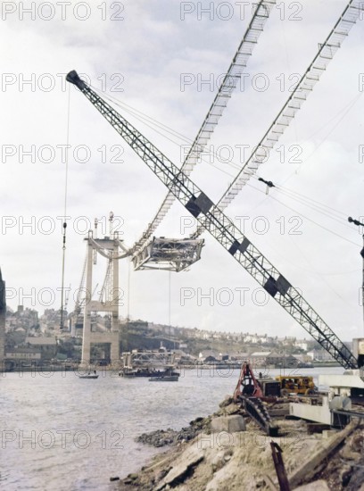Construction of the Tamar Bridge in progress completed in 1961, view to Saltash, Cornwall from Plymouth, Devon, England, UK c 1960