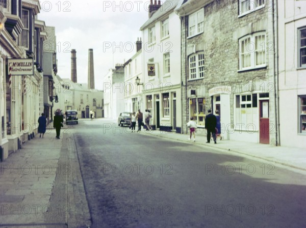 NB Poor focus, Historic Southside Street, Maritime Inn pub view to chimneys of gin distillery, Barbican, Plymouth, Devon, England, UK, c 1960