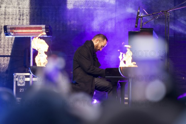 Igor Levit (pianist) plays the piano at the lighting of the 20th anniversary Hanukkah in front of the Brandenburg Tor, Berlin, 17.12.2025