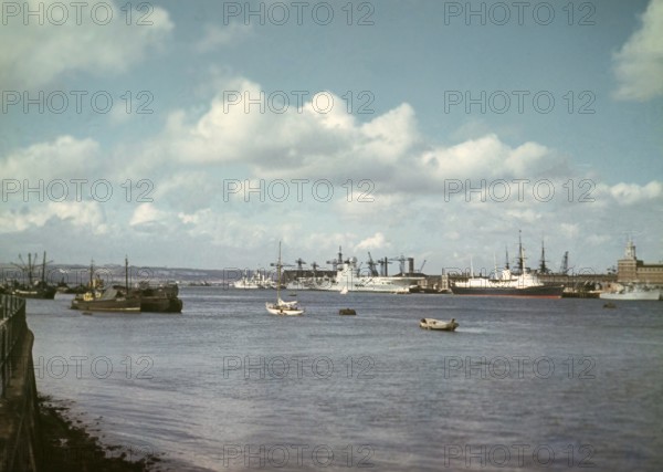 Aircraft carrier HMS Ark Royal (R09) or her sister ship HMS Eagle (R05), with Royal Yacht Britannia, Portsmouth Harbour, Hampshire, England, c 1956