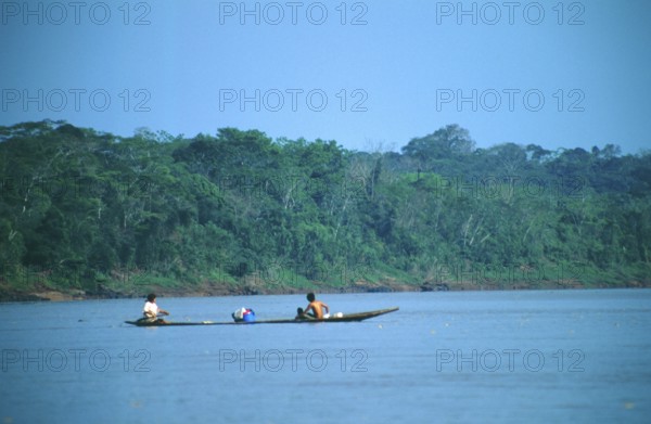 Boat traffic on the Rio Tambopata near Puerto Maldonado in the Amazon Basin, Peru, South America, September 1997, vintage, retro, old, historic