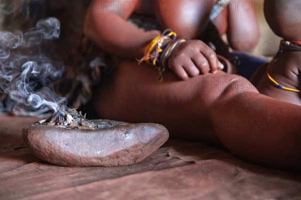 Detail, Himba perfume, scented smoke from burning plants, Himba village, Kaokoveld, Kunene, Namibia