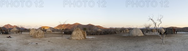 Panorama, Himba huts, traditional Himba village in the savanna, arid landscape, Kaokoveld, Kunene, Namibia