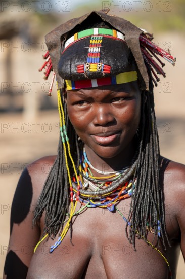 Portrait, brightly decorated woman of the Hakaona tribe, also Havakona or Hakawona, near Opuwo, Kunene, Namibia