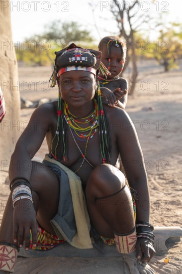 Portrait, brightly decorated woman and customer of the Hakaona tribe, also Havakona or Hakawona, near Opuwo, Kunene, Namibia