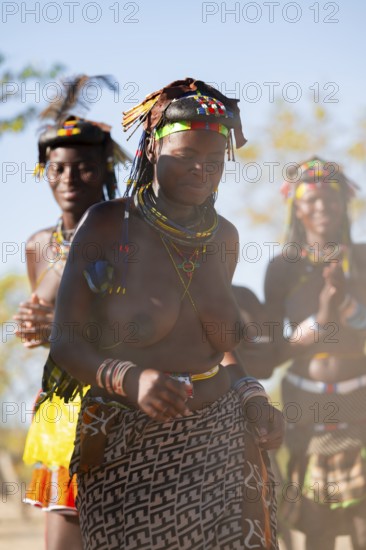 Traditional dance, brightly decorated woman of the Hakaona tribe, also Havakona or Hakawona, near Opuwo, Kunene, Namibia