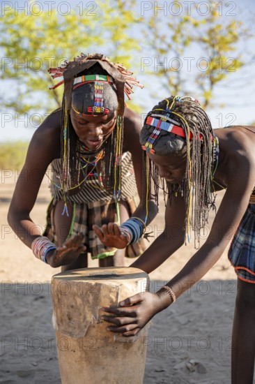 Traditional dance, brightly decorated woman of the Hakaona tribe, also Havakona or Hakawona, at Opuwo, Kunene, Namibia