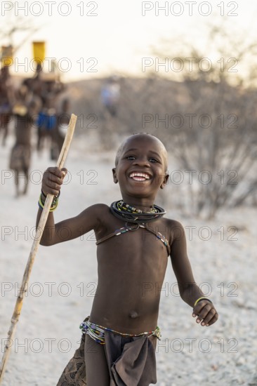 Happy Himba child laughing, traditional Himba village, Kaokoveld, Kunene, Namibia