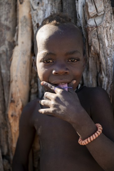 Portrait, cheerful Himba child, traditional Himba village, Kaokoveld, Kunene, Namibia