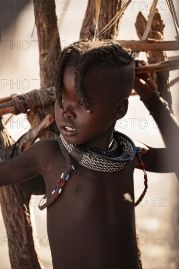 Portrait, young Himba child, traditional Himba village, Kaokoveld, Kunene, Namibia